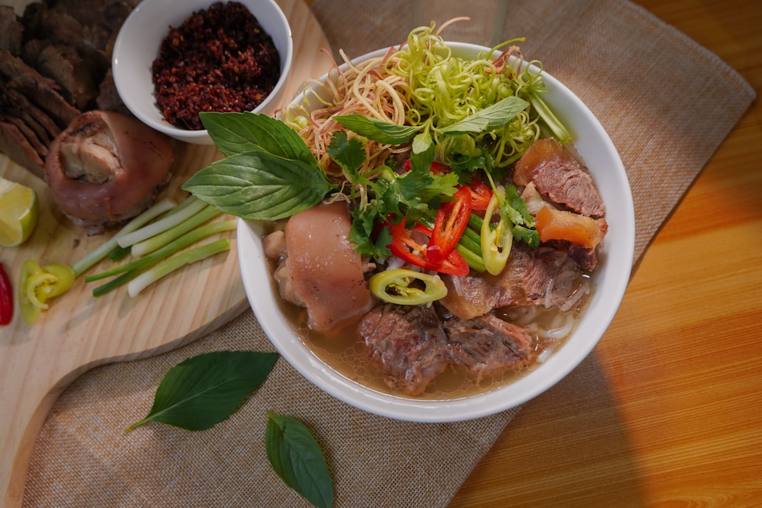 A richly colored bowl of Bún Bò Huế — centuries of tradition in a single serving
