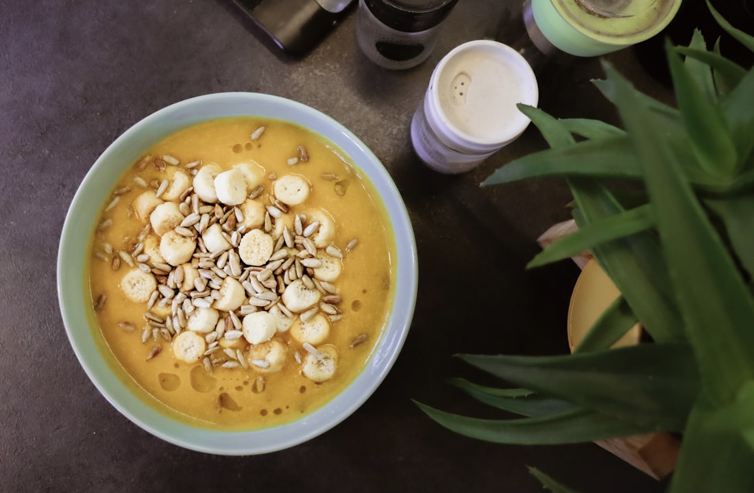 A home kitchen setup with a pot of aromatic broth simmering — weeknight Bún Bò Huế in progress